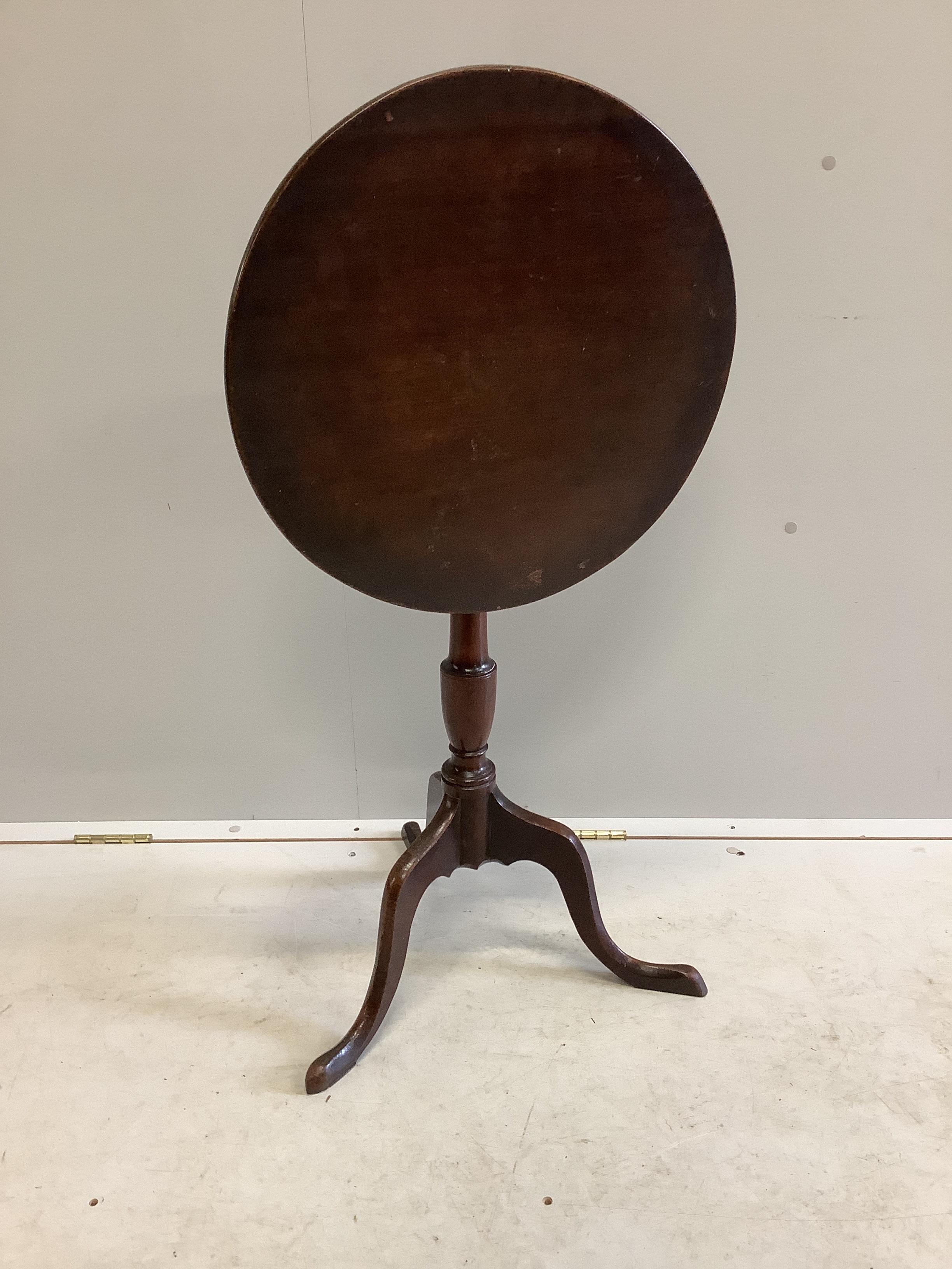 A George III circular mahogany tilt top tripod wine table, diameter 48cm, height 71cm